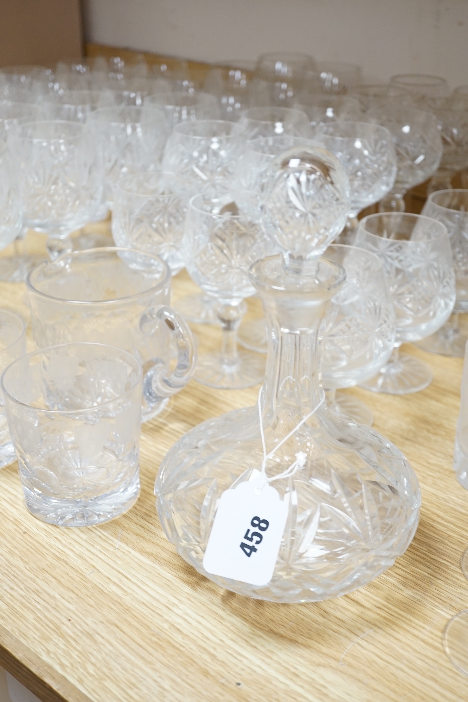 Various suites of star cut Thomas Webb drinking glasses, together with three decanters, pair of whisky tumblers and jug, five tumblers and three engraved Aston Villa champagne flutes, (approx. 89 items)
